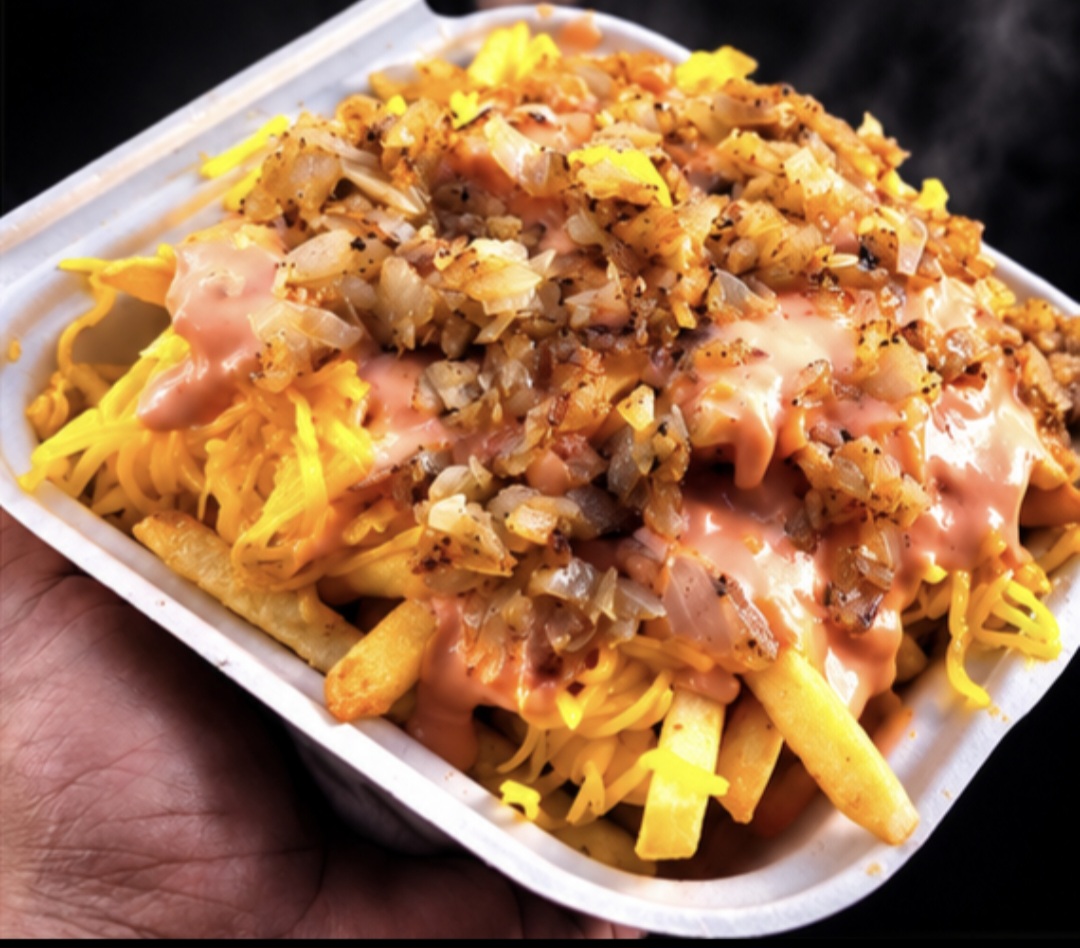Animal style fries covered with cheese and toppings