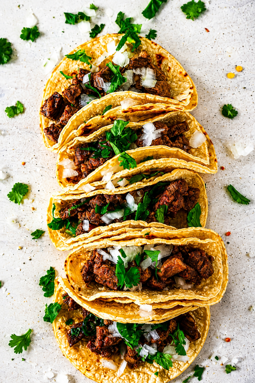 Platter of tacos with fresh toppings